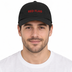 RED FLAG Adjustable Dad Hat — black Cap on man model, white studio