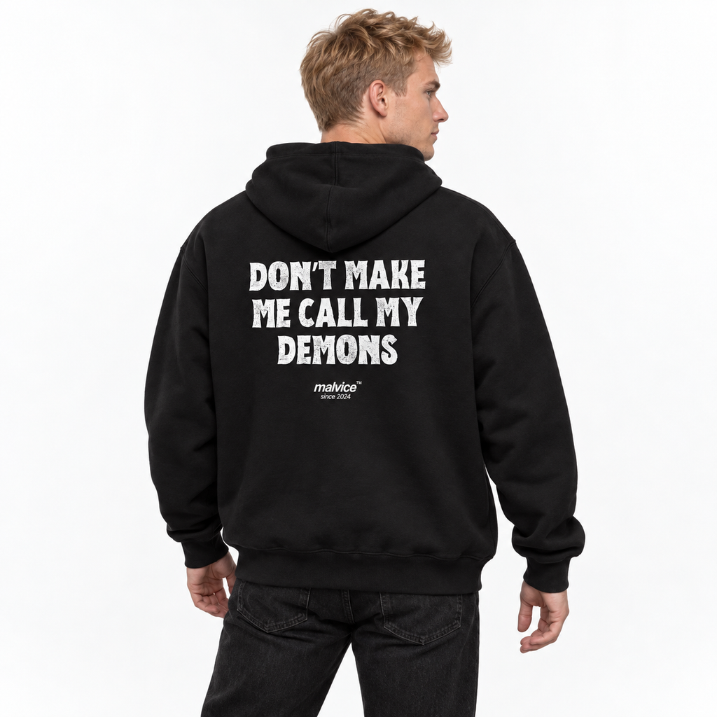 N016 DON’T MAKE ME CALL MY DEMONS Oversized Hoodie — black hoodie on male model, white studio — MALVICE