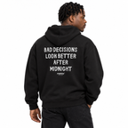 N017 BAD DECISIONS LOOK BETTER AFTER MIDNIGHT Oversized Hoodie — black hoodie on male model, white studio — MALVICE