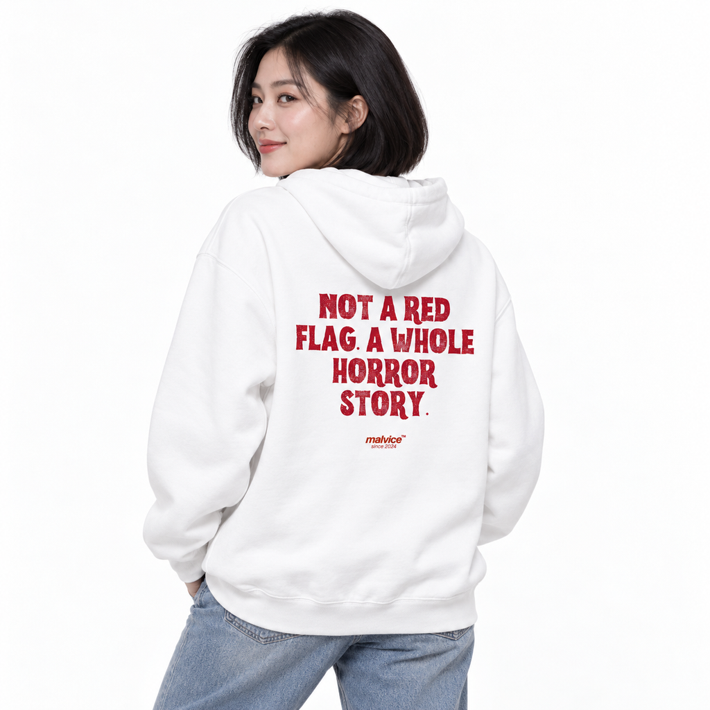 N019 NOT A RED FLAG. A WHOLE HORROR STORY Oversized Hoodie — white hoodie on female model, white studio — MALVICE