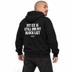 N024 — MY EX IS STILL ON MY BLOCK LIST Oversized Hoodie — black oversized hoodie on male model, back view, white studio — MALVICE