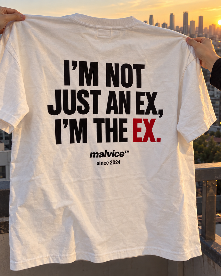 White MALVICE I'm Not Just an Ex I'm the Ex oversized T-shirt held at sunset