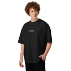 Model wearing a black MALVICE oversized T-shirt, front view